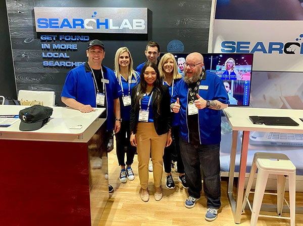 The SearchLab team poses for a photo in their office.